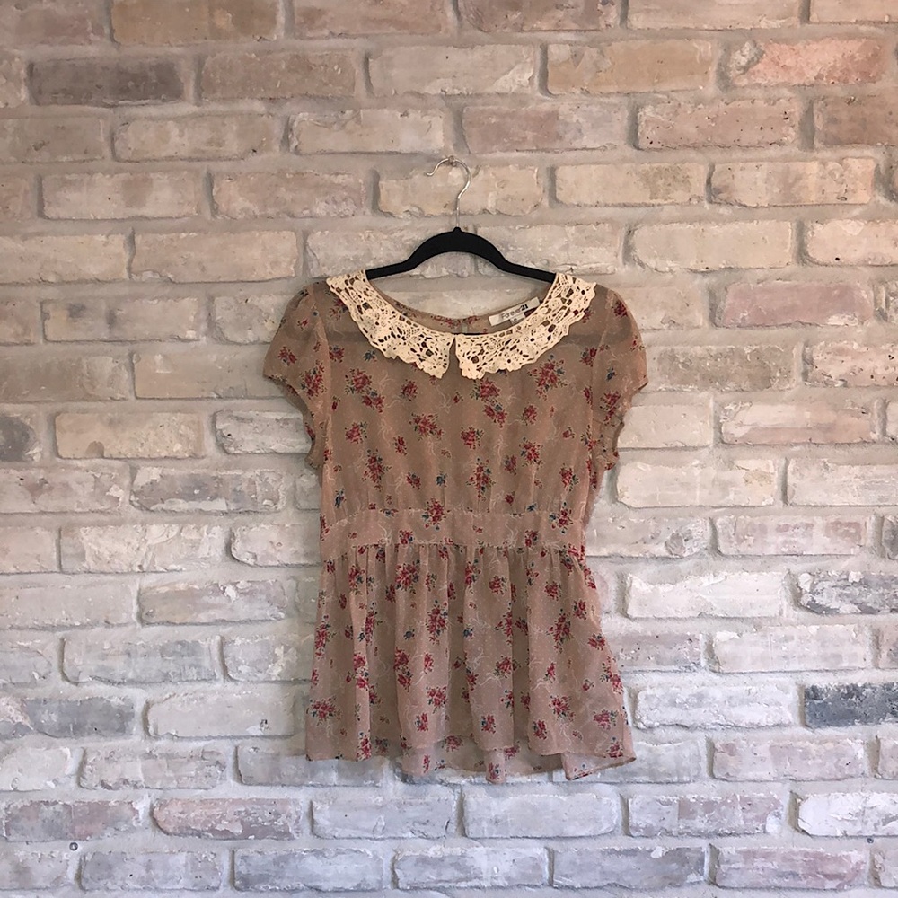 Retro inspired sheer top with cinched waist and lace collar detail